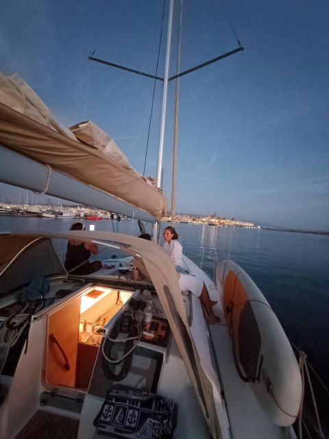 Alghero: Sunset Sailing Aperitif Experience - Swimming and snorkeling at Maddalenetta