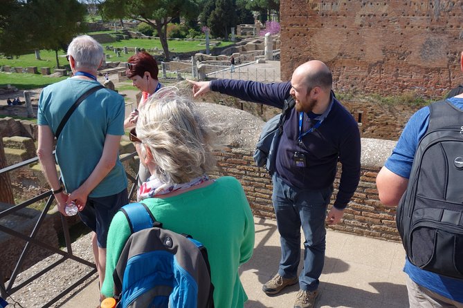 Ancient Ostia Antica Semi-Private Day Trip from Rome by Train with Guide - Shops, apartments, and ordinary Roman routines