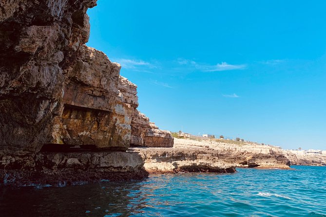 Boat tour of the Polignano a Mare caves with aperitif - Lama Monachile, Polignano’s postcard beach