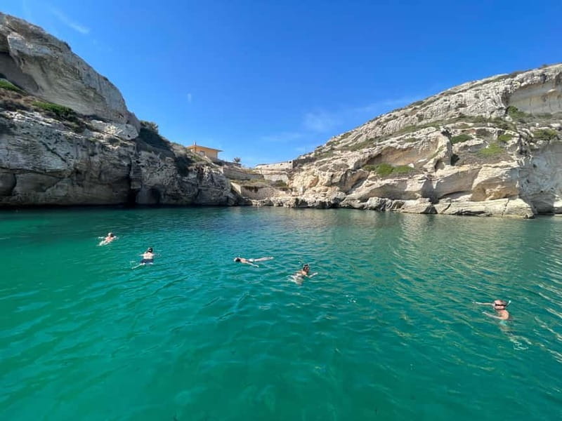 Cagliari: Boat Tour with 4 Swim Stops, Snorkeling & Prosecco - Four stops chosen by the skipper