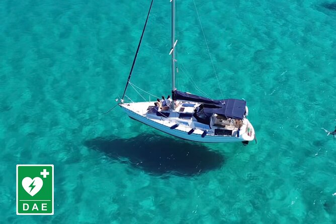 Catamaran tour stops bathing and snorkeling toast with prosecco - A small boat view of Cagliari