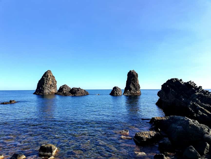 Catania: Cyclops Coast Cruise with Appetizer & Snorkeling - Aci Trezza and the Cyclops Islands from the sea