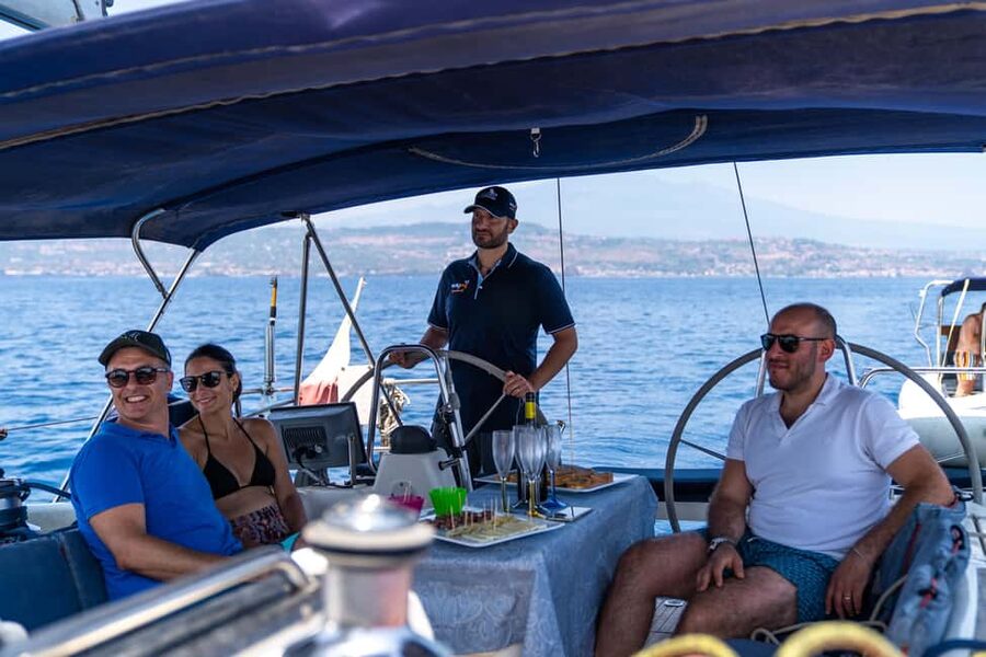Catania: Cyclops Coast Cruise with Appetizer & Snorkeling - Black lava rock and the Cyclops Coast