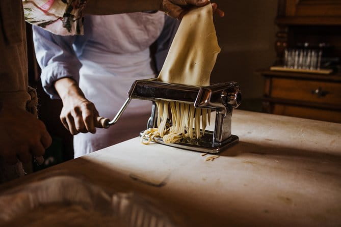 Cooking Class and Lunch at a Tuscan Farmhouse with Local Market Tour from Florence - Sitting down to a four-course Tuscan lunch