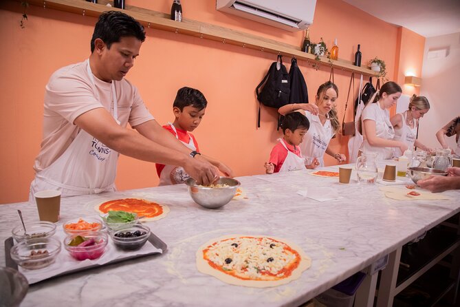 Florence Cooking Class The Art of Making Gelato & Authentic Pizza - Chefs who keep the room moving