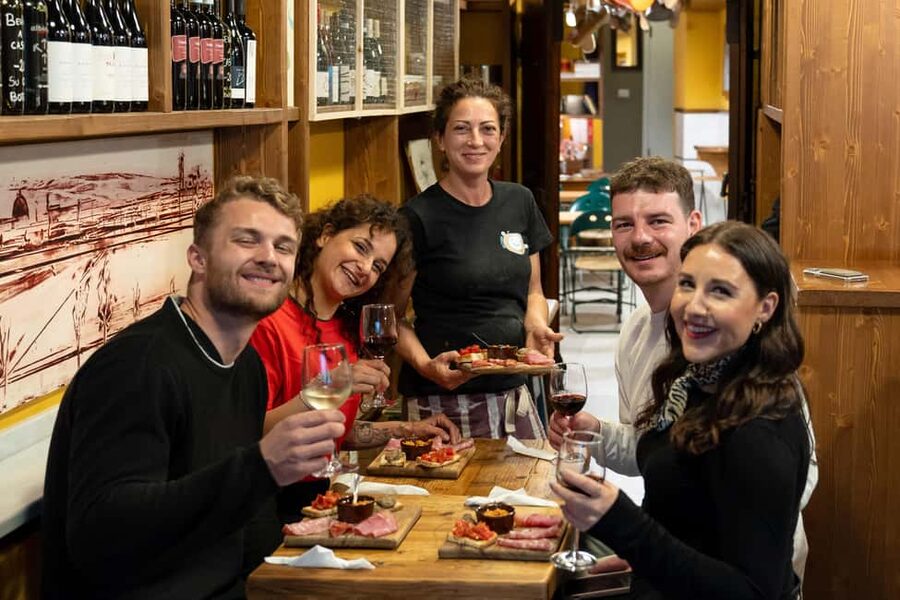 Florence: Food Walking Tour with Local Steak and Tuscan Wine - The old wine window and Florence’s aperitivo tradition