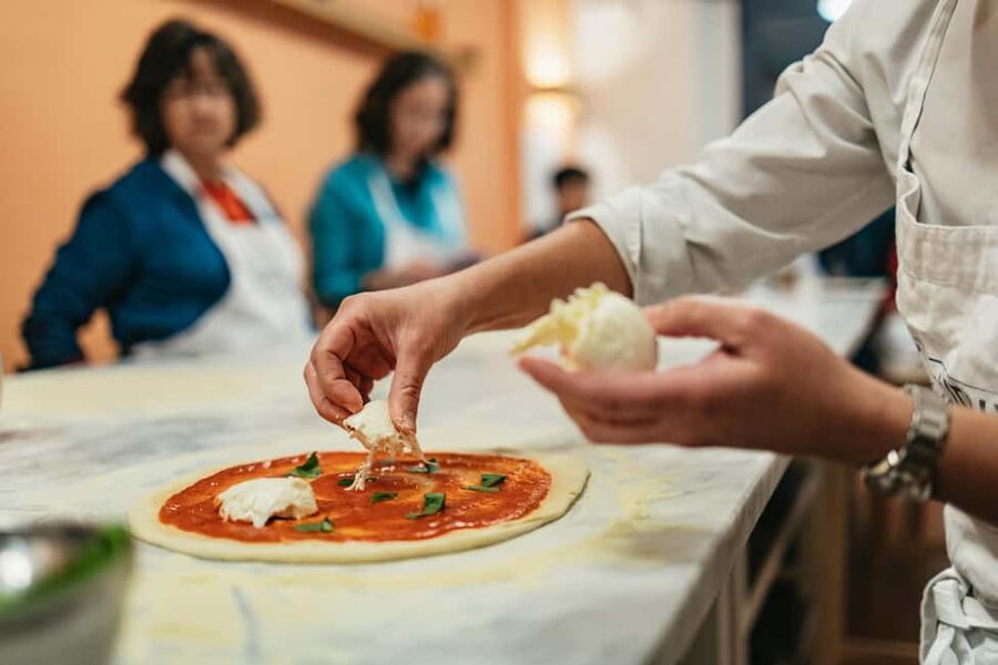 Florence: Pizza and Gelato Preparation Class - Making pizza near Florence’s San Lorenzo Market