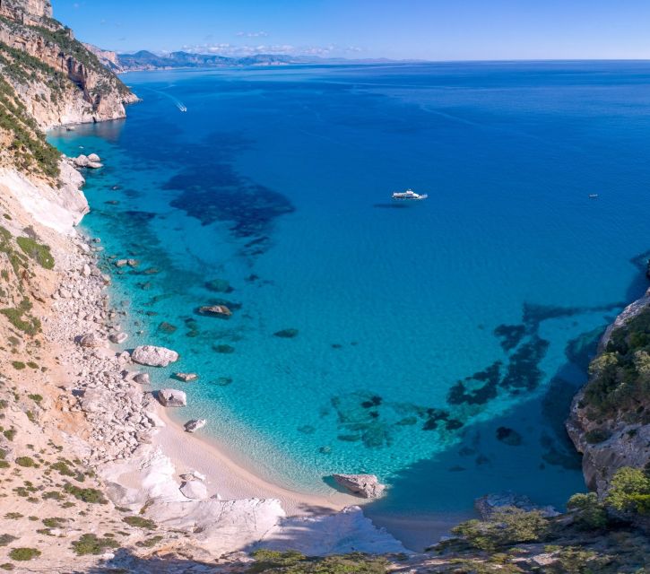 From Cala Gonone: Orosei Gulf Cruise with Stops - Leaving Cala Gonone on a two-deck motorboat