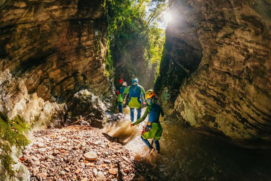 From Tignale, Lake Garda: Beginner-Friendly Canyoning Tour - The eight-minute van ride and the walk to the canyon