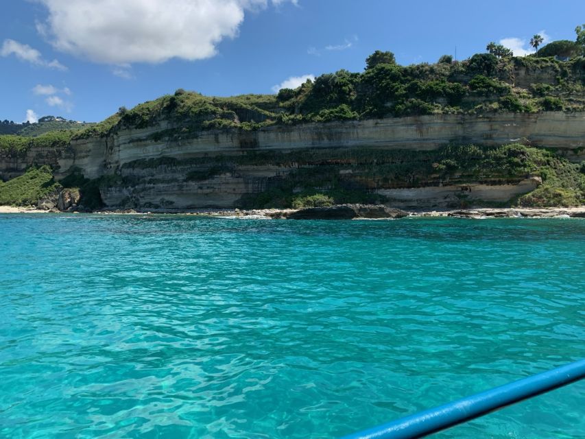 From Tropea: Capo Vaticano boat tour with snorkel & aperitif - The main stop at Grotticelle Bay