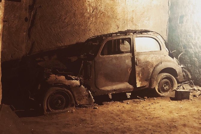 Galleria Borbonica Entrance Ticket in Standard Route - Old cars, Vespas, and objects left below Naples