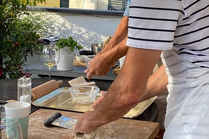 Homemade Pasta and Pesto Class with a Local Chef in Genoa - Rolling dough for picagge pasta