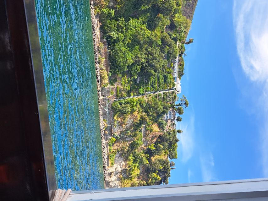 Ischia: Island Boat Tour with Neapolitan Lunch & Snorkeling - Maronti and Scarrupata show the wilder coast
