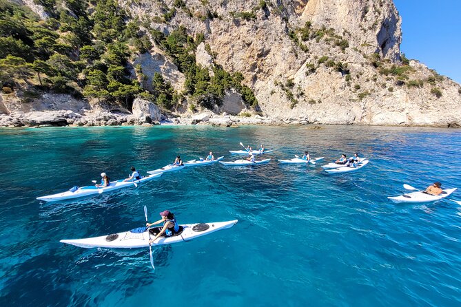 Kayak tour in Capri between caves and beaches. Photos included. - The first paddling lesson for beginners