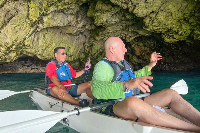 Kayak tour in Capri between caves and beaches. Photos included. - A swim, Arco della Stella, and the Faraglioni