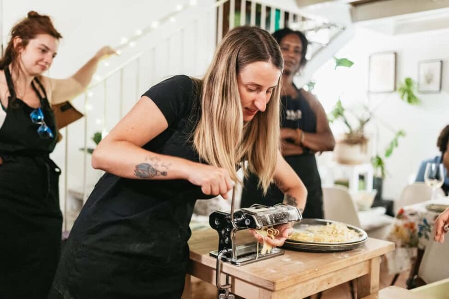 Milan: Pasta & Tiramisu Cooking Class with Premium Products - Sitting down to eat what you made