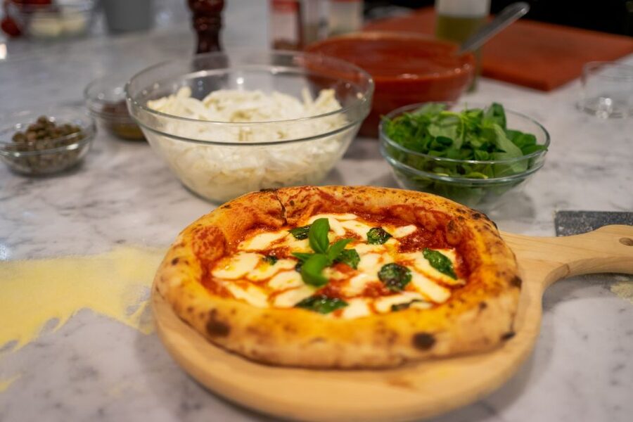 Milan: Pizza or Pasta and Gelato-Making Class with Wine - Rolling dough and preparing the main course