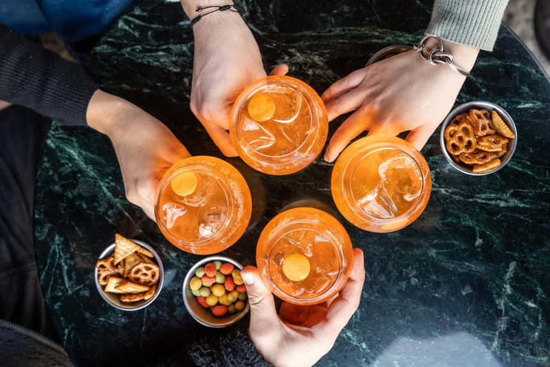 Milan: Sunset Navigli Food & Drinks Tour with a Local - Stop one: learning the Milanese aperitivo habit