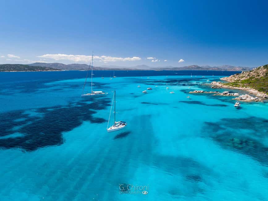 Olbia: Dolphin Watching & Snorkeling Boat Tour near Figarolo - Searching for dolphins at Capo Figari