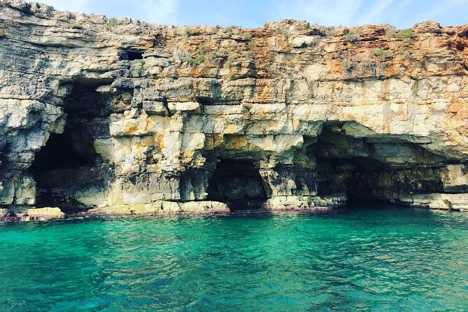 Polignano a Mare boat tour emotions, caves, diving and appetizers - The Lama Monachile aperitivo