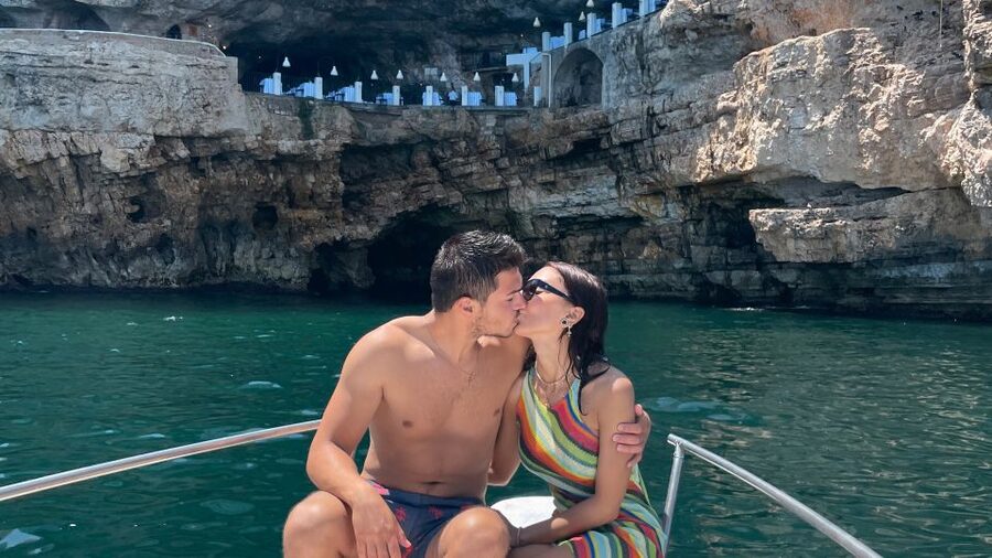 Polignano a Mare: Speedboat Cruise to Caves with Aperitif - Lama Monachile Beach from below the cliffs