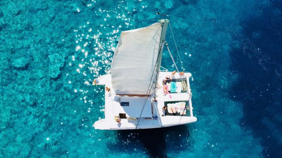 Porto Conte: Half-day catamaran tour with aperitif - Sailing Along the Mediterranean Coast