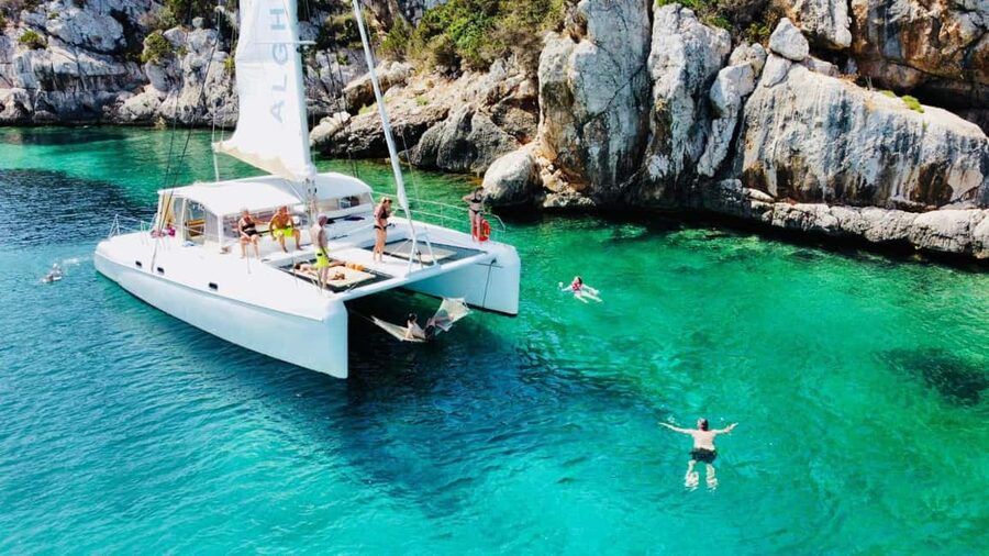 Porto Conte: Half-day catamaran tour with aperitif - Cala Dragunara and the Swimming Stop