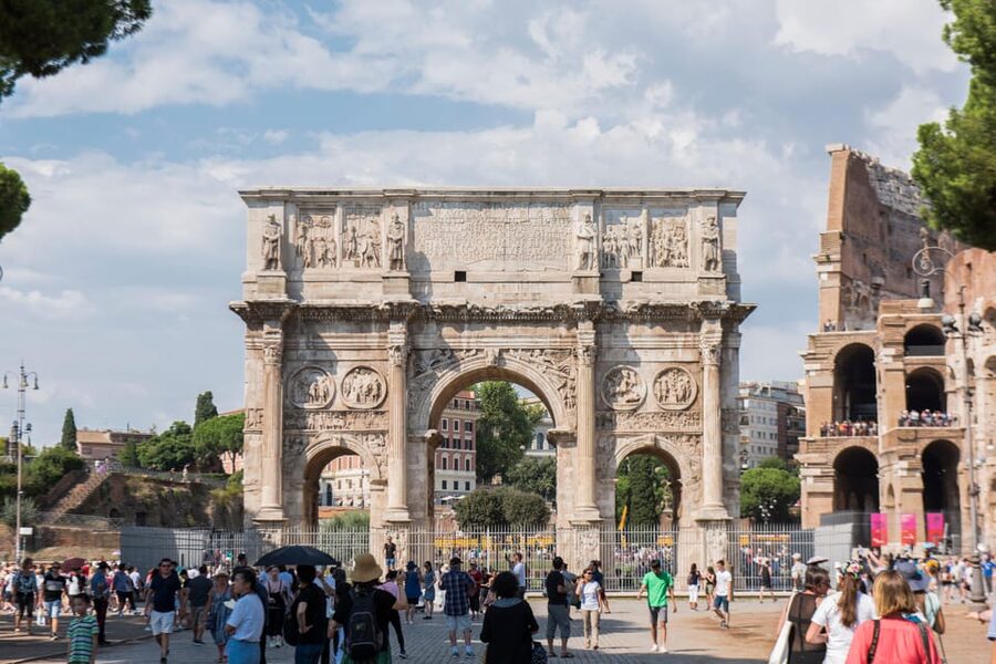 Rome: Colosseum Arena, Roman Forum & Palatine Tour - Walking through the Roman Forum