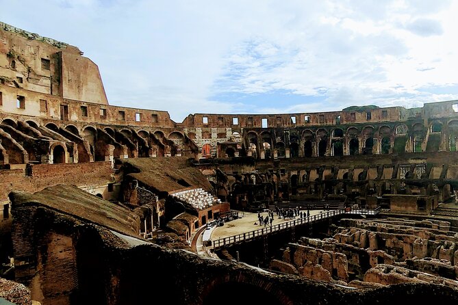 Rome: Colosseum Express Guided Tour - Entering the Colosseum and reading the ruins