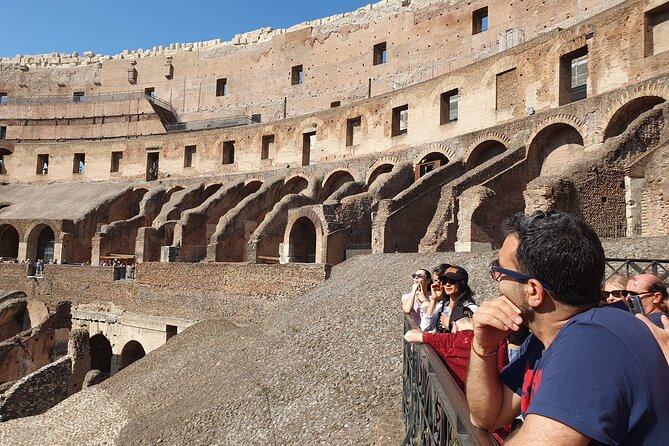 Rome: Colosseum, Roman Forum & Palatine Hill Experience - Entering the Colosseum with a guide
