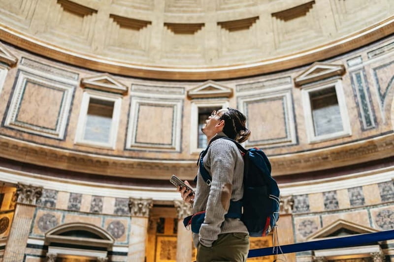 Rome: Pantheon Fast-Track Ticket and Official Audio Guide - Inside the portico, look at the stone before the dome