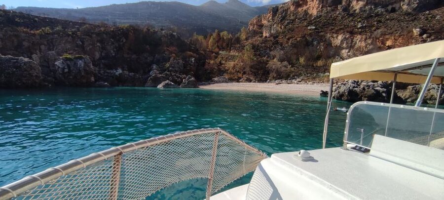 San Vito Lo Capo: Boat Trip with 3 Swimming Stops and Snacks - Sicilian food and wine on the way back