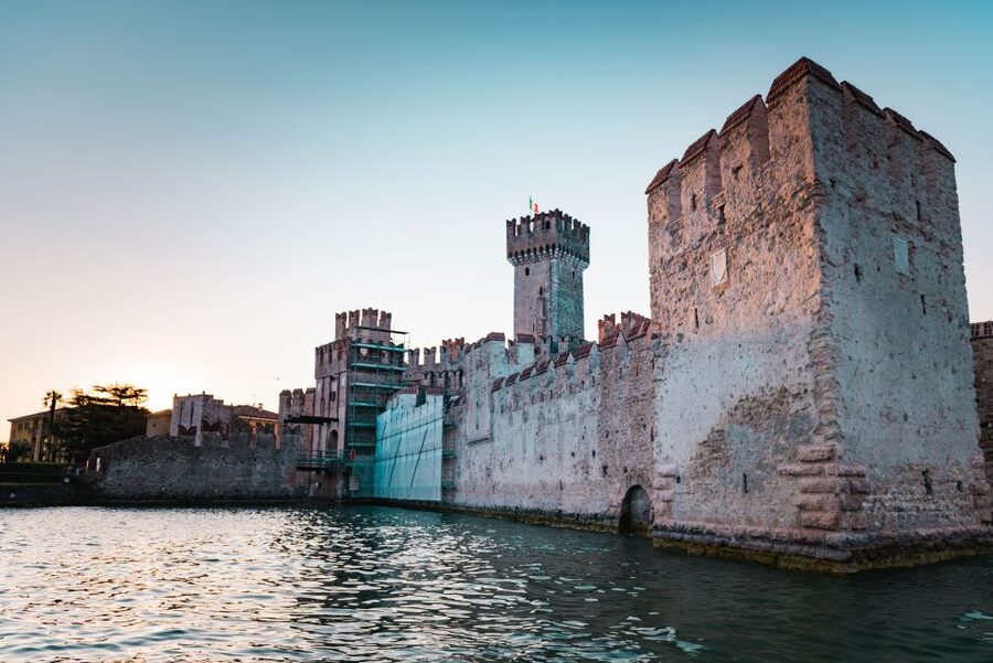Sirmione: Sunset Boat Cruise with Local Wine - The Grotte di Catullo at sunset