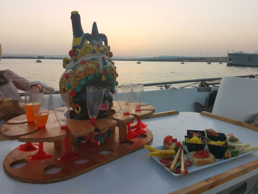 Syracuse: Ortigia Sunset Cruise with Aperitif - Grotta delle Stalattiti, the largest cave stop