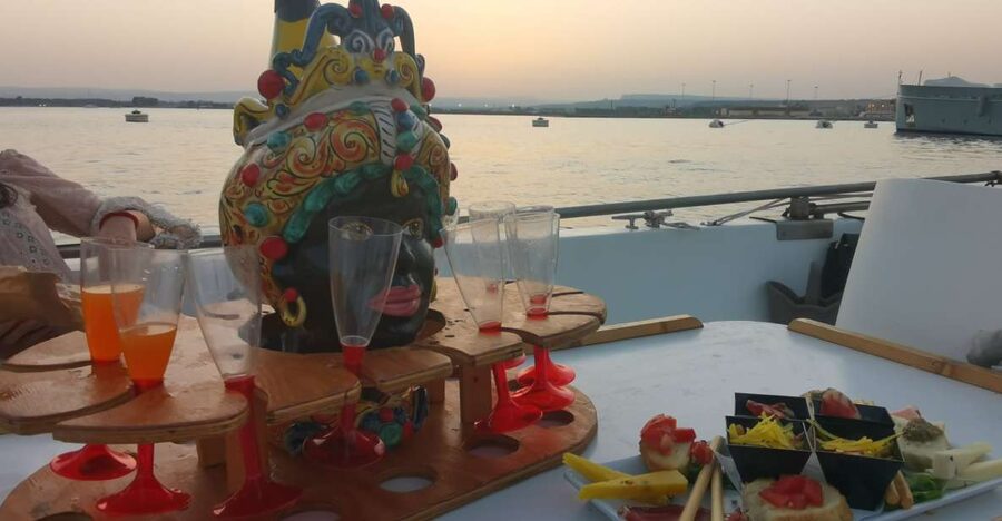 Syracuse: Ortigia Sunset Cruise with Aperitif - Coral Caves and Grotta dell’Amore