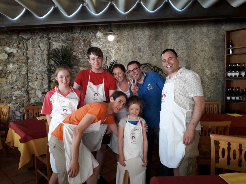 Taormina: Half-Day Pizza Making Class - A long table of food, wine, and conversation