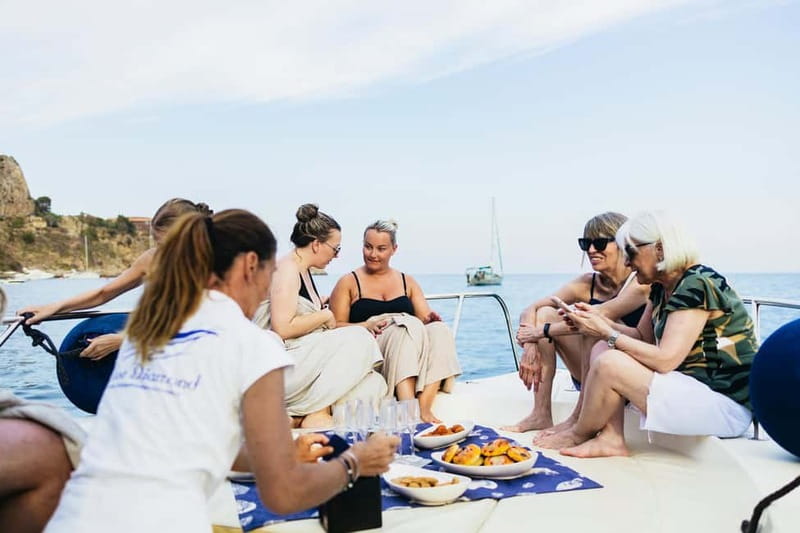 Taormina: Sunset Boat Tour with Dolphin Watching & Aperitif - Swimming and snorkeling in Taormina Bay